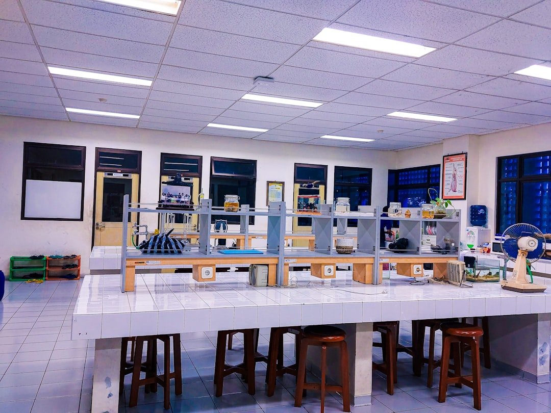 a-room-filled-with-lots-of-tables-and-stools-ndgbzwndfyy